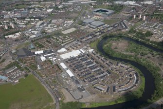 Oblique aerial view of the Commonwealth Games Village, Celtic Park and Emirates Arena, looking NNE.