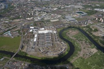 Oblique aerial view of the Commonwealth Games Village, Celtic Park and Emirates Arena, looking N.