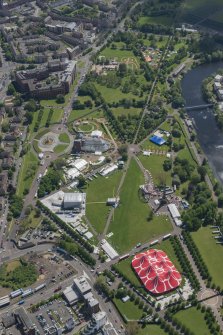Oblique aerial view of Radio 1's Big Weekend at Glasgow Green, Nelson Monument and Peoples' Palace, looking SSE.