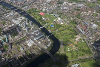 Oblique aerial view of Radio 1's Big Weekend at Glasgow Green, Nelson Monument and People's Palace, looking NNW.