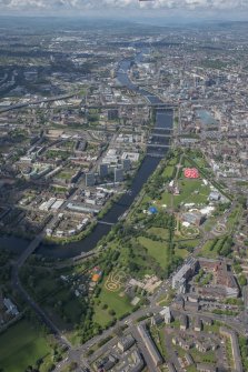 Oblique aerial view of Radio 1's Big Weekend at Glasgow Green, Nelson Monument and People's Palace, looking NW.