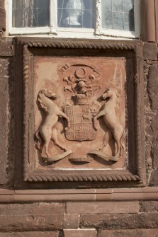 South elevation. Detail of armorial panel above doorway.