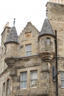Detail of turrets on corner of St Mary's Street and 1-7 Holyrood Road, Edinburgh.