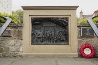 View of sculpture in wall in front of bowling green adjacent to Callander House and Whitefoord House, Canongate, Edinburgh.
