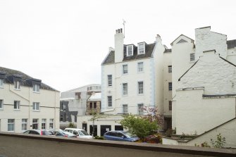 General view of rear elevations of tenements at 55-61 Canongate, Edinburgh, from NW.