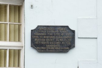 Detail of plaque on corner of 55 Canongate, Edinburgh.