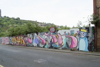 General view of graffiti art on hoardings around Caltongate Development site on New Street, Edinburgh, from N.