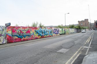 General view of graffiti art on hoardings around Caltongate Development site on New Street, Edinburgh, from S.