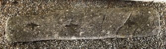 Recumbent slab with 3 incised crosses