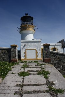 Flannan Isle lighthouse. View of tramway leading through the enclosure wall to the engine room and workshop, facing east.