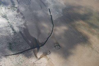 Oblique aerial view of the fish traps at Ardoch, looking SE.