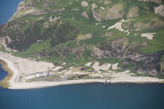 Oblique aerial view of Ailsa Craig Castle, Foreland Point Lighthouse and gasworks, looking S.