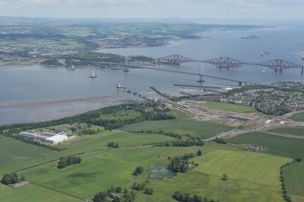 General oblique aerial view of the Upper Firth of Forth with The Queensferry Crossing construction, Forth Road bridge and Forth bridge in the distance, looking NE.
