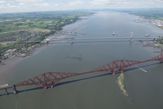 General oblique aerial view of the Upper Firth of Forth with The Queensferry Crossing construction, The Forth Road bridge and Forth bridge, looking W.
