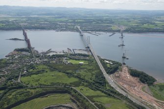 General oblique aerial view of the Upper Firth of Forth with The Queensferry Crossing construction, The Forth Road bridge and Forth bridge, looking SSW.