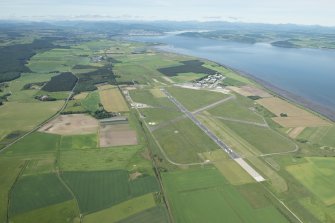 Oblique aerial view of Inverness Airport with Inverness in the distance, looking WSW.