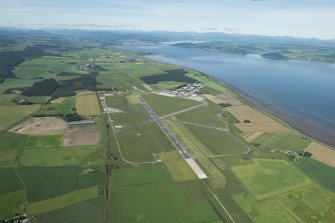 Oblique aerial view of Inverness Airport with Inverness in the distance, looking WSW.