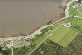 Oblique aerial view of the fish trap and the Fort George sports ground, looking SW.