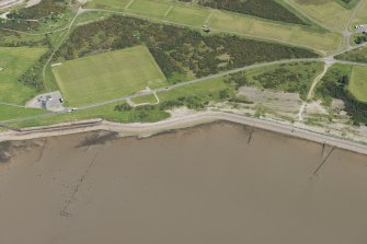 Oblique aerial view of the fish trap and Fort George sports ground, looking SE.