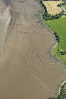 Oblique aerial view of the remains of the  fish traps, looking NNE.