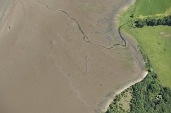 Oblique aerial view of the remains of the  fish traps, looking NNE.