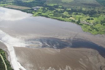 Oblique aerial view centred on the possible fish trap or weir, looking SSW.