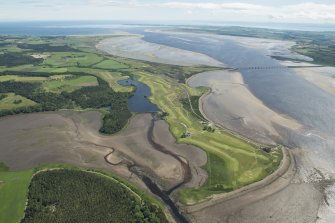 General oblique aerial view of the Carnegie Golf Course and the Meikle Ferry pier with the Dornoch Firth road bridge beyond, looking E.