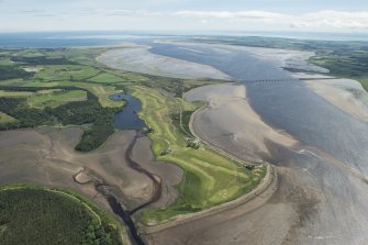 General oblique aerial view of the Carnegie Golf Course and the Meikle Ferry pier with the Dornoch Firth road bridge beyond, looking E.