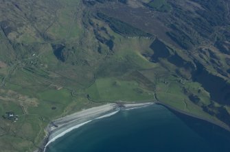 Aerial view from the N. The farm of Laig is towards the right with the former loch to its left, indicated by uncultivated ground. Sròn Laimhrige (Rock of the Landing Place) is at top centre, topped by a triangular wood. (Colin Martin)