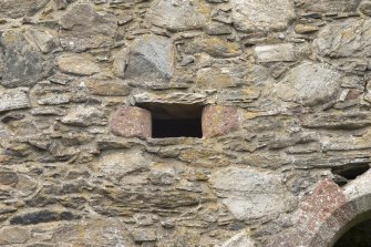 Invermark Castle. Detail of small window to left and above 1st floor entrance on south face