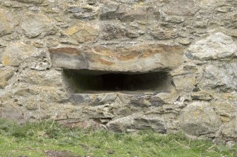 Invermark Castle. Basement, detail of horizontal slit window opening at east end of south face