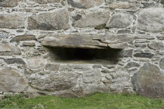 Invermark Castle. Basement, detail of horizontal slit window opening at south end of east face