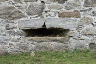 Invermark Castle. Basement, detail of horizontal slit window opening at east end of north face