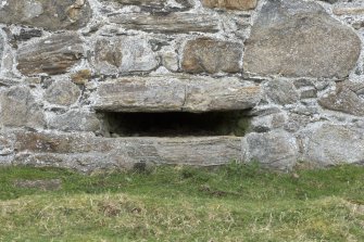 Invermark Castle. Basement, detail of horizontal slit window opening in centre of north face