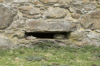 Invermark Castle. Basement, detail of horizontal slit window opening at north end of west face
