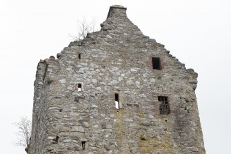Invermark Castle. View of roof line and upper windows on west face