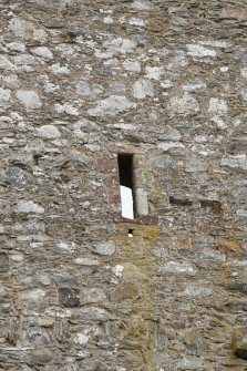 Invermark Castle. Detail of small slit window at 3rd floor level of west face