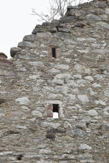 Invermark Castle. Detail of two small slit windows at 3rd and attic levels of west face