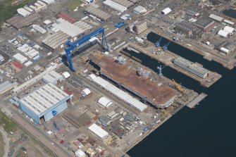 Oblique aerial view of the building of the aircraft carrier, HMS Elizabeth at Rosyth Dockyard, looking E.