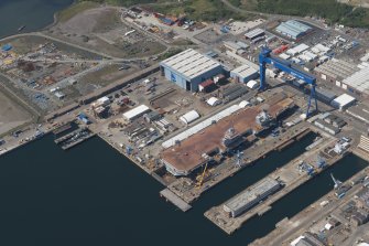 Oblique aerial view of the building of the aircraft carrier, HMS Elizabeth at Rosyth Dockyard, looking NW.