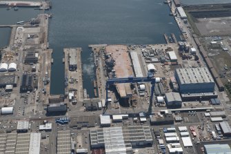 Oblique aerial view of the building of the aircraft carrier, HMS Elizabeth at Rosyth Dockyard, looking SW.