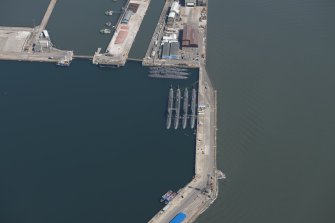 Oblique aerial view of the submarines in the main basin of Rosyth Dockyard, looking SE.