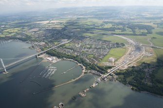 Oblique aerial view of the construction of the Queensferry Crossing and Port Edgar, looking SE.