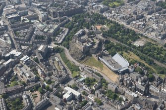 Oblique aerial view of Edinburgh Castle and Esplanade, looking WNW.