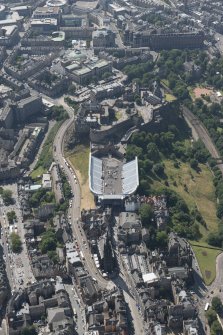 Oblique aerial view of Edinburgh Castle and Esplanade, looking W.