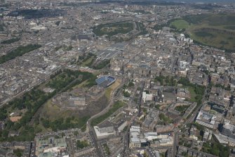 General oblique aerial view of Edinburgh Old Town, Edinburgh Castle and Waverley Station, looking NE.