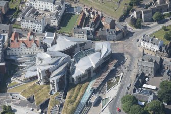 Oblique aerial view of the Scottish Parliament, looking NW.