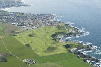 Oblique aerial view of the Royal Tarlair Golf Course with Macduff beyond, looking W.