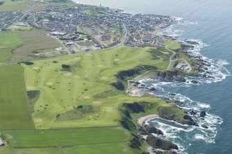 Oblique aerial view of the Royal Tarlair Golf Course with Macduff beyond, looking WSW.