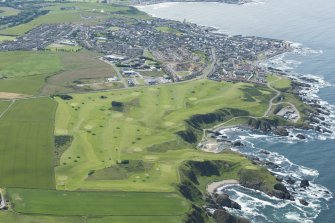 Oblique aerial view of the Royal Tarlair Golf Course with Macduff beyond, looking WSW.